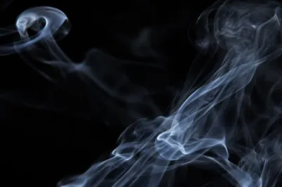 Dramatic Blue Smoke on Dark Background