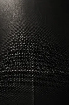 Subtle Cross on Dark Textured Fabric
