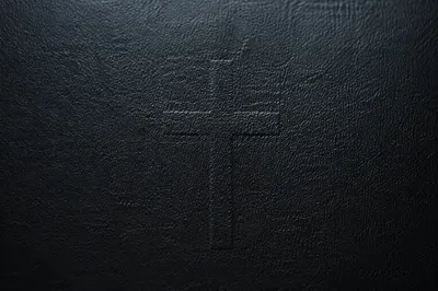 Dark Textured Background with Subtle Cross