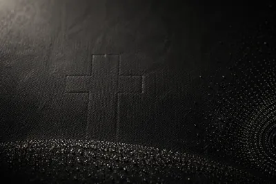Dark Textured Background with Subtle Cross