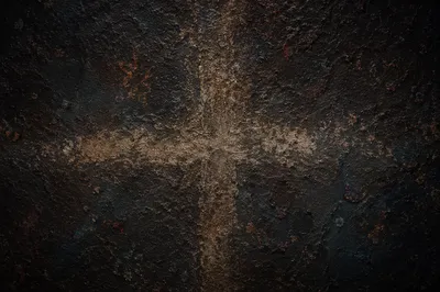 Dark Textured Background with Subtle Cross