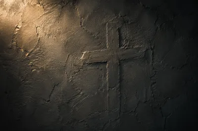 Subtle Cross on Dark Charcoal Plaster