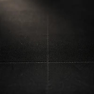 Subtle Cross on Dark Textured Fabric