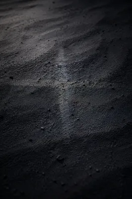 Dark Textured Surface With Subtle Cross