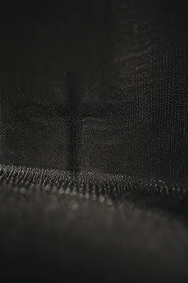 Dark Textured Background with Subtle Cross