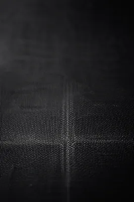 Subtle Cross on Dark Textured Background