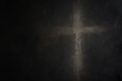 Subtle Cross on Dark Textured Plaster