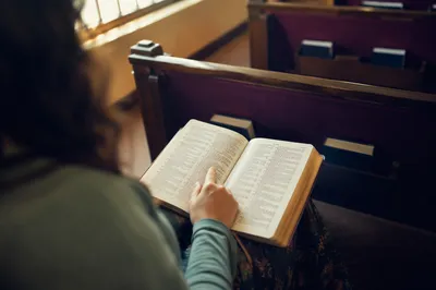 Reading Scripture in Warm Chapel Interior
