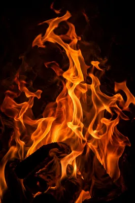 Dark Dramatic Flames Over Charred Wood