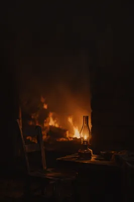 Oil Lamp and Chair in Shadows
