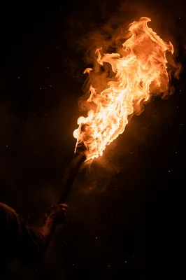 Dramatic Torch Flame Dark Background
