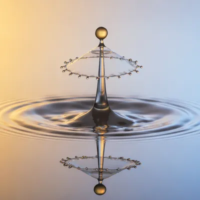 Golden Water Drop Splash Reflection