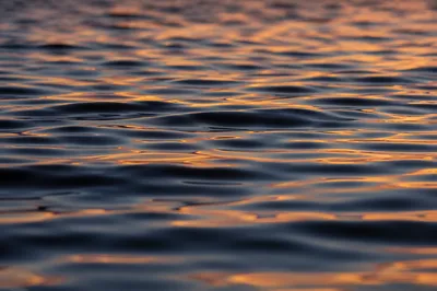 Golden Sunset Reflections on Flowing Water