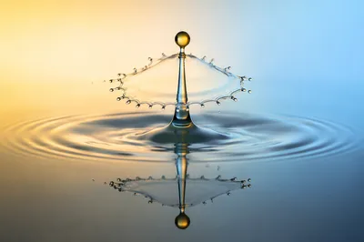 Golden Water Drop Splash Reflection