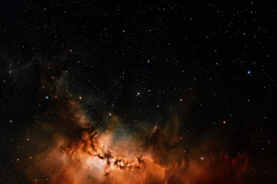 Orange Nebula in Dark Star Field
