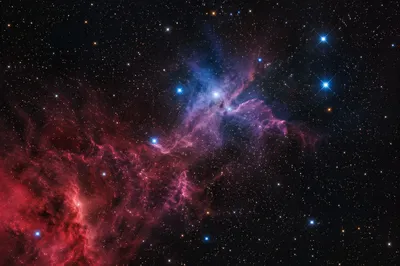 Crimson Nebula Over Dark Starfield