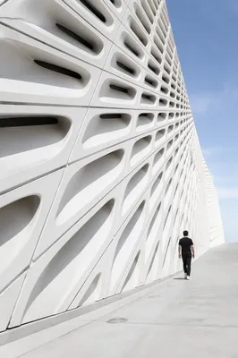 Minimalist Geometric Facade With Walking Figure