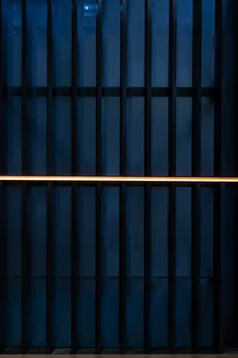 Minimalist Blue Glass Slats With Amber Light