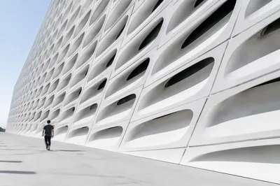 Minimalist Geometric Facade with Futuristic Walkway