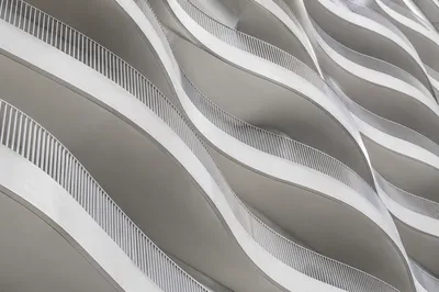 Minimalist White Facade Geometric Waves