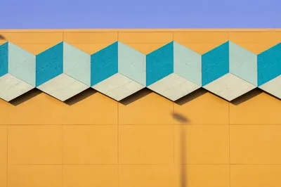 Modern Geometric Ochre Facade Background
