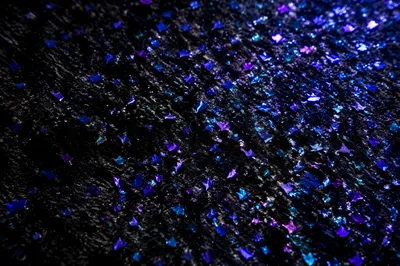 Festive Violet Glitter Background on Black