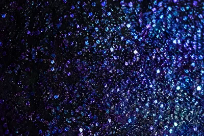 Festive Violet Glitter on Black Background