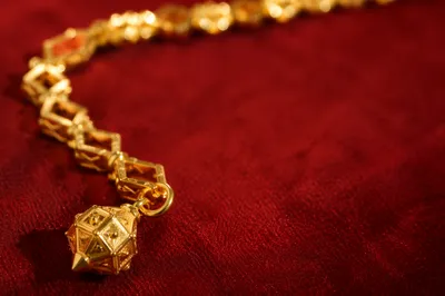 Elegant Gold Chain on Crimson Velvet