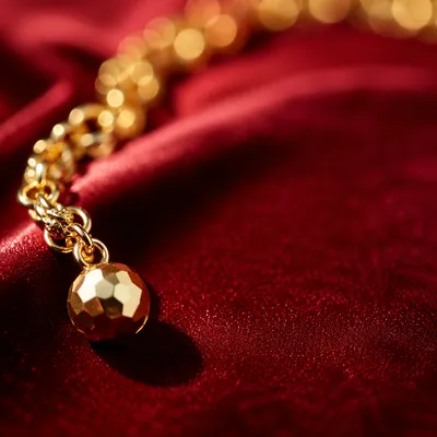 Elegant Gold Chain on Crimson Velvet