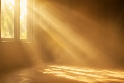 Golden Light Rays in Serene Mist