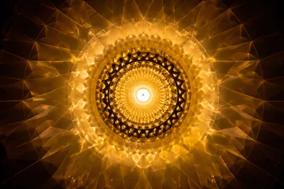 Golden Radial Light Pattern on Dark