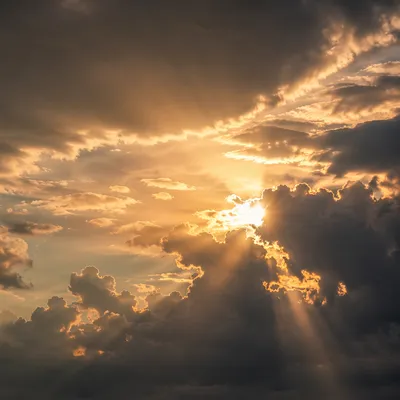 Golden Heavenly Light Rays Through Clouds