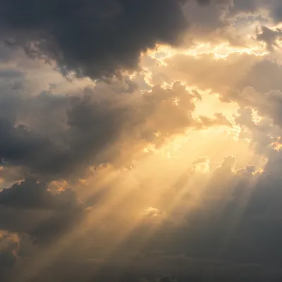 Golden Light Rays Through Heavenly Clouds