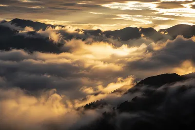 Golden Heavenly Light Through Mountain Clouds