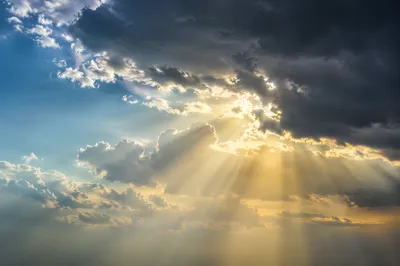 Golden Sunbeams Through Heavenly Storm Clouds