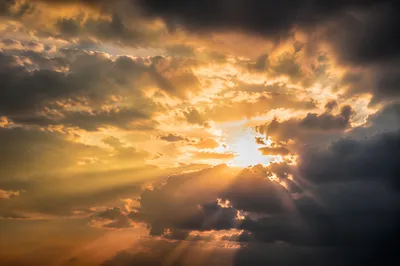 Golden Sun Rays Through Heavenly Clouds