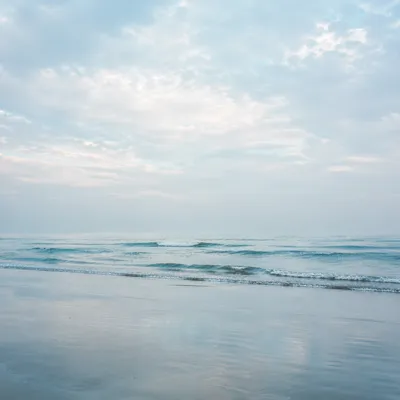 Soft Coastal Blue Background with Misty Sky