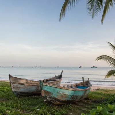 Calming Coastal Boats on Light Blue Shore