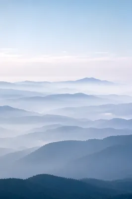 Soft Blue Misty Mountain Background