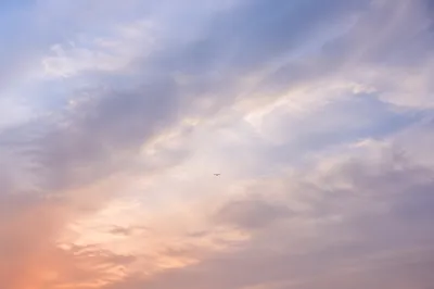 Soft Blue Sky with Layered Clouds