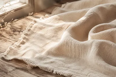 Neutral Cream Linen on Wooden Surface