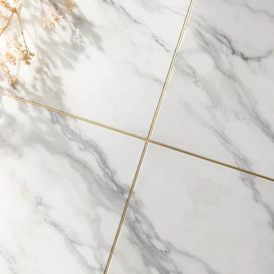 White Marble Background With Gold Cross Accent