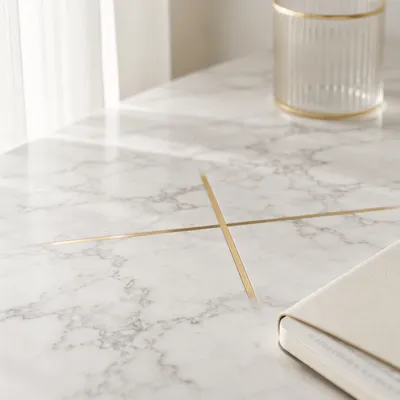 White Marble Background with Gold Cross Accent