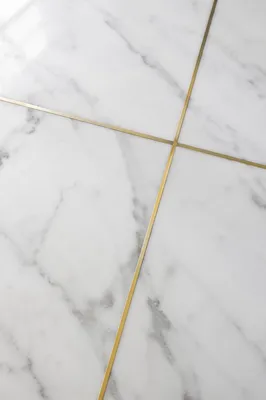 White Marble Background with Gold Cross Accent