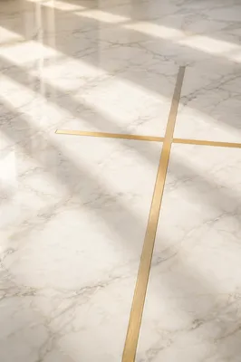 White Marble Background with Gold Cross Accent