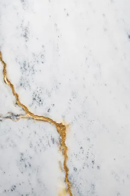 White Marble Background with Gold Cross Accent