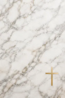 White Marble Background with Gold Cross Accent