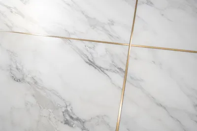 White Marble Background with Gold Cross Accent