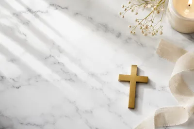 White Marble Background with Gold Cross Accent