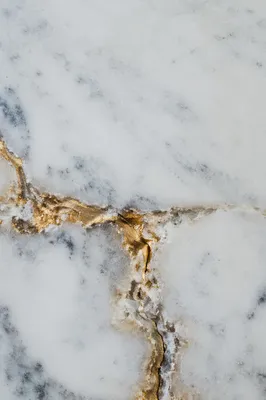 White Marble Background with Gold Cross Accent